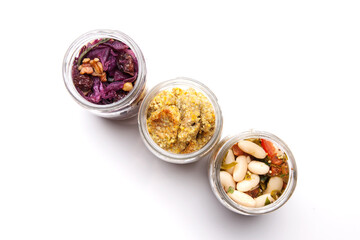 Nutrition concept - Healthy food, Diet, Detox, Clean Eating or Vegetarian concept. A glass jar of nutritious food against white background. Delicious take away food in glass jars.
