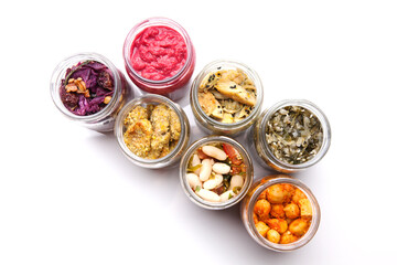 Nutrition concept - Healthy food, Diet, Detox, Clean Eating or Vegetarian concept. A glass jar of nutritious food against white background. Delicious take away food in glass jars.