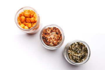 Nutrition concept - Healthy food, Diet, Detox, Clean Eating or Vegetarian concept. A glass jar of nutritious food against white background. Delicious take away food in glass jars.