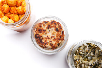 Nutrition concept - Healthy food, Diet, Detox, Clean Eating or Vegetarian concept. A glass jar of nutritious food against white background. Delicious take away food in glass jars.
