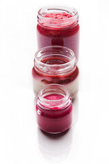 Nutrition concept - Healthy food, Diet, Detox, Clean Eating or Vegetarian concept. A glass jar of nutritious desert food against white background. Delicious take away food in glass jars.