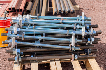 View of the anchor boalts with galvanized and non-galvanized and their with nuts and washers. anchor bolts (also named fasteners), steel plates , stiffners. © Funtay