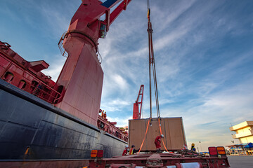 Package unit of the heavy life cargo being discharging or loading by the ship crane under...