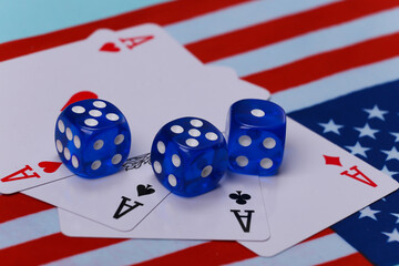 Four aces and dice on the background of the USA flag.