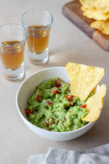 Mexican dip sauce guacamole with nachos chips. Mexican food. Healthy eating. Vegetarian food.
