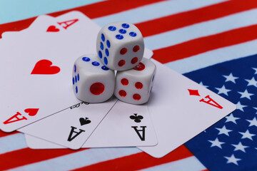Four aces and dice on the background of the USA flag.