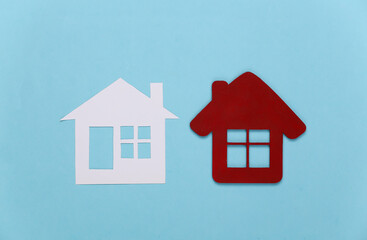 Fototapeta na wymiar Two house figure on blue background.