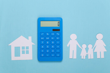 Paper happy family together with house, calculator on blue background. Calculation of family expenses, budget