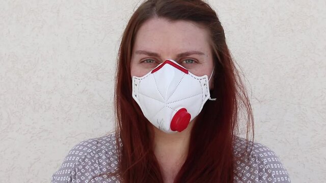 Young woman in mask ffp3 as a individual protection device against coronavirus. Protection. Conavirus and Covid-19 Concet
