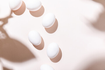 top view of boiled chicken eggs on grey table with shadows