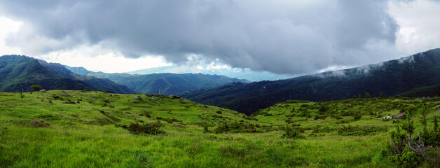 Panoramic green landscape with dramatic sky, Gran Sasso, Abruzzo, Italy
