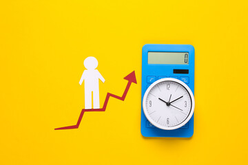 Paper man on growth arrow, clock and calculator. Yellow background. Symbol of financial and social success, stairway to progress. Career time. © splitov27