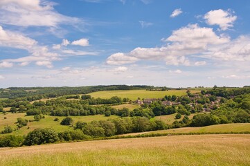 Fototapeta na wymiar A view of the Cotswold village of Snow Hill, Gloucestershire on a sunny summer's day.