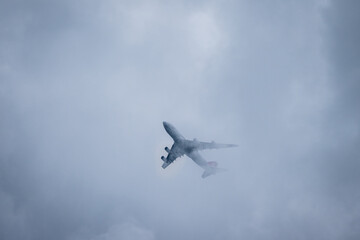 Fototapeta na wymiar airplane in dust and dark clouds
