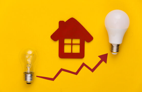 The concept of modernization of power consumption. Eco, save the energy. Old and modern light bulb with house, growth arrow on yellow background