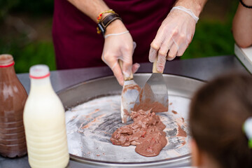 natural fruit chocolate ice cream are prepared in fresh air and roll in roll.