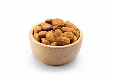 Almonds in wooden bowl isolated on white background