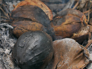Burnt coconut has a pleasant aroma, good taste and smoke in warm light background concept