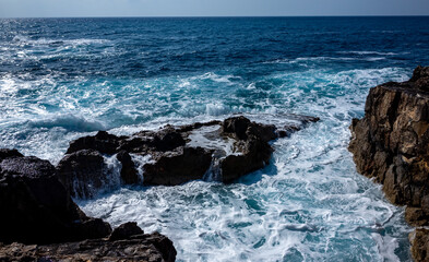 Waves crash on the rocky shore of the Mediterranean Sea on the Akamas Peninsula in the northwest of the island of Cyprus.