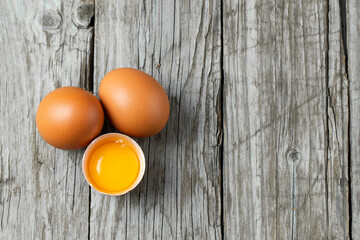 Close-up view of raw eggs isolated on Brown background.
