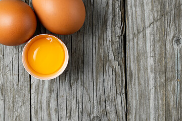 Close-up view of raw eggs isolated on Brown background.