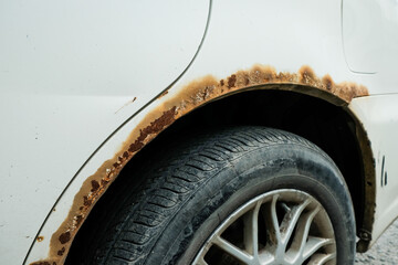 Rusted wheel arch at car. car corrosion