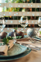 Luxury green table setting decorated with candles