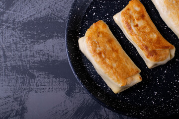 Pancakes with filling roasted on the pan
