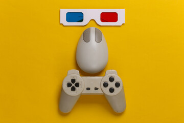 Retro entertainment. Attributes, gadgets 80s. Old-fashioned pc mouse, gamepad, anaglyph stereo glasses on yellow background. Top view. Flat lay