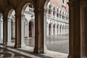 Fototapeta na wymiar View into the courtyard of the Doge's Palace through the arches of the gallery.