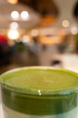 cup of matcha milk tea on table