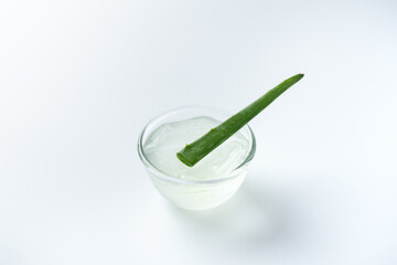 Slice aloe vera and gel on white background