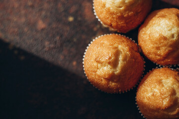 Beautiful tasty muffins on a dark background