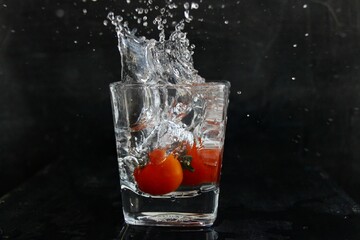 Fototapeta na wymiar cocktails with cherry tomatoes and splash 