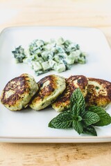 vegan lentils burgers with cucumber salad and mint