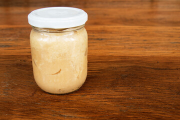 Nutrition concept - Green Banana Biomass in glass jar, good source of fiber, vitamins and minerals, and contains a starch that may help control blood sugar, manage weight and lower blood cholesterol.