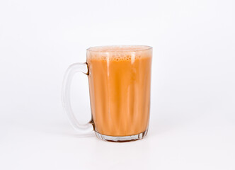 Teh tarik or pulled tea is a famous sweet milk tea in Malaysia. Bubble is floating on the surface of teh tarik.