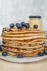 American pancakes with honey and blueberries