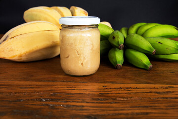 Nutrition concept - Green Banana Biomass in glass jar, good source of fiber, vitamins and minerals, and contains a starch that may help control blood sugar, manage weight and lower blood cholesterol.