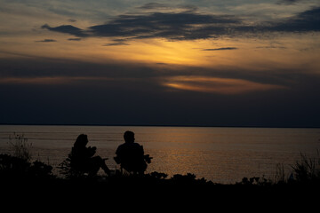 silhouette of a couple on the beach