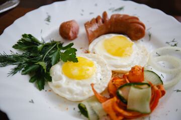 Breakfast on a white plate. Close-up. Top view