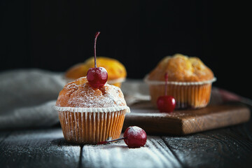 Freshly baked muffins with cherries