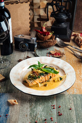 Appetizing gourmet salmon steak with creamy sauce