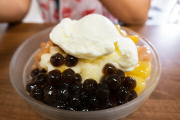 eating shaved ice with colorful dessert
