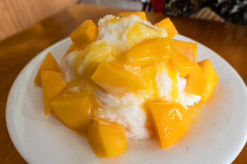 eating mango shaved ice