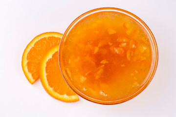 Fototapeta na wymiar Bowl of orange jam isolated