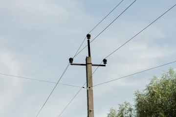 pole with electric wires in the village