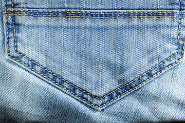 Jeans background. Concept for advertising clothes. The most popular fabric. Close-up. The texture...