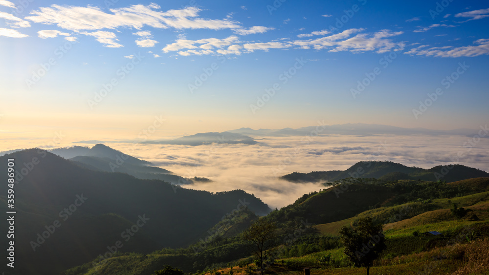 Wall mural landscape view at morning time sea fog on the mountain beautiful landmark