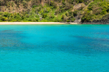 The Beautiful view of Sancho Beach from the sea, with turquoise clear water, at Fernando de Noronha Marine National Park, a Unesco World Heritage site, Pernambuco, Brazil